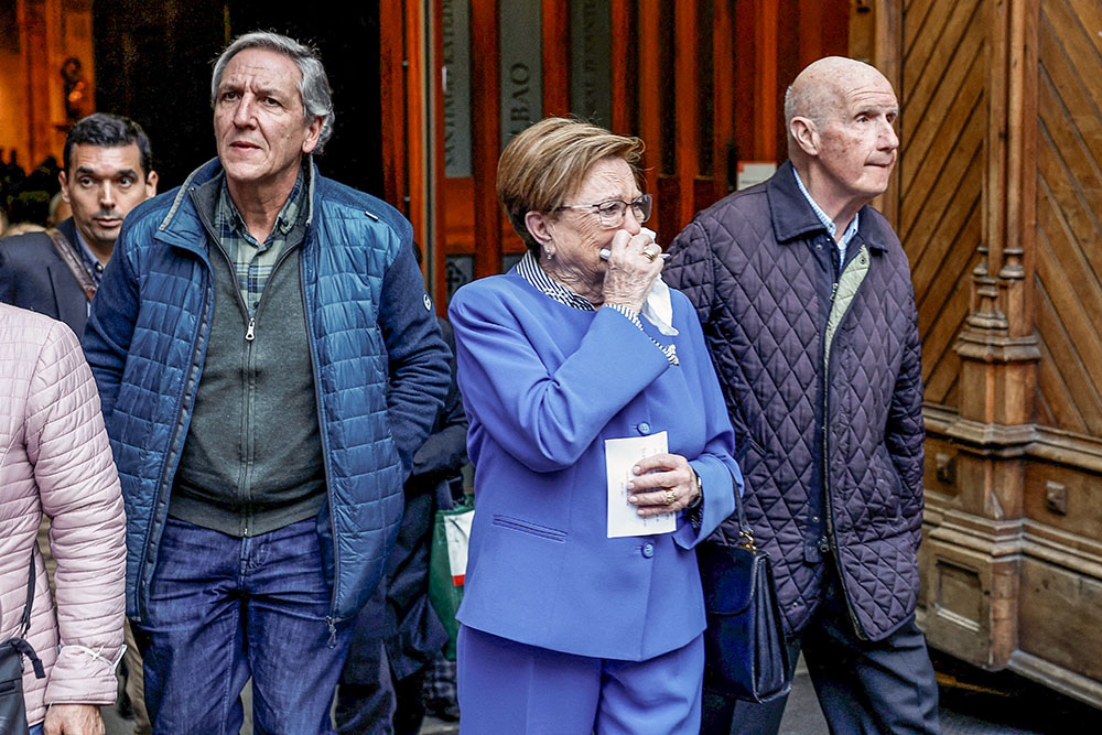 A woman reacts while leaving a Mass at the Bilbao Cathedral in Spain, March 24, 2023, where forgiveness was asked from victims of sexual abuse within the Catholic Church. The Mass was concelebrated by Bishop Joseba Segura of Bilbao, and Fr. Josu Lopez Villalba, a victim of sexual abuse. (OSV News/Reuters/Vincent West)