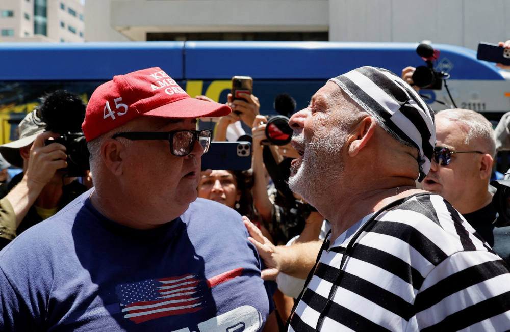 A supporter of former U.S. President Donald Trump and an anti-Trump demonstrator argue near the Wilkie D. Ferguson Jr. U.S. Courthouse, on the day Trump appeared for his arraignment on classified document charges, in Miami June 13, 2023. (OSV News photo/Marco Bello, Reuters)