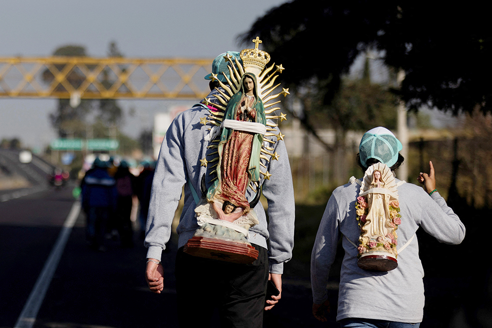 Pilgrims walk toward the Basilica of Our Lady of Guadalupe in Mexico City Dec. 11, 2024, to participate in her Dec. 12 feast day celebrations. (OSV News/Reuters/Quetzalli Nicte-Ha)