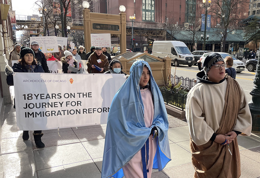 Participants of the 18th Annual Posada Seeking Immigration Reform continue their procession in 2023 in Chicago. (Courtesy of the Archdiocese of Chicago)