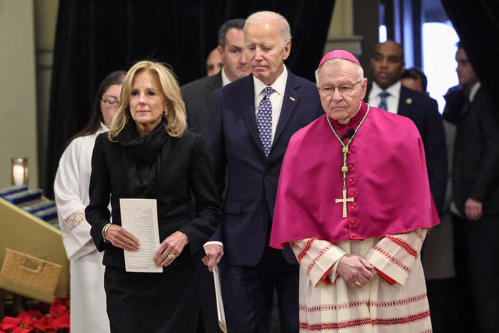 President Joe Biden and first lady Jill Biden walk alongside New Orleans Archbishop Gregory Aymond as they arrive Jan. 6, 2025, at St. Louis Cathedral in New Orleans for an interfaith prayer service in memory of the 14 people killed during New Year's celebrations in the city's famed French Quarter early Jan. 1. (OSV News/Reuters/Kevin Lamarque)