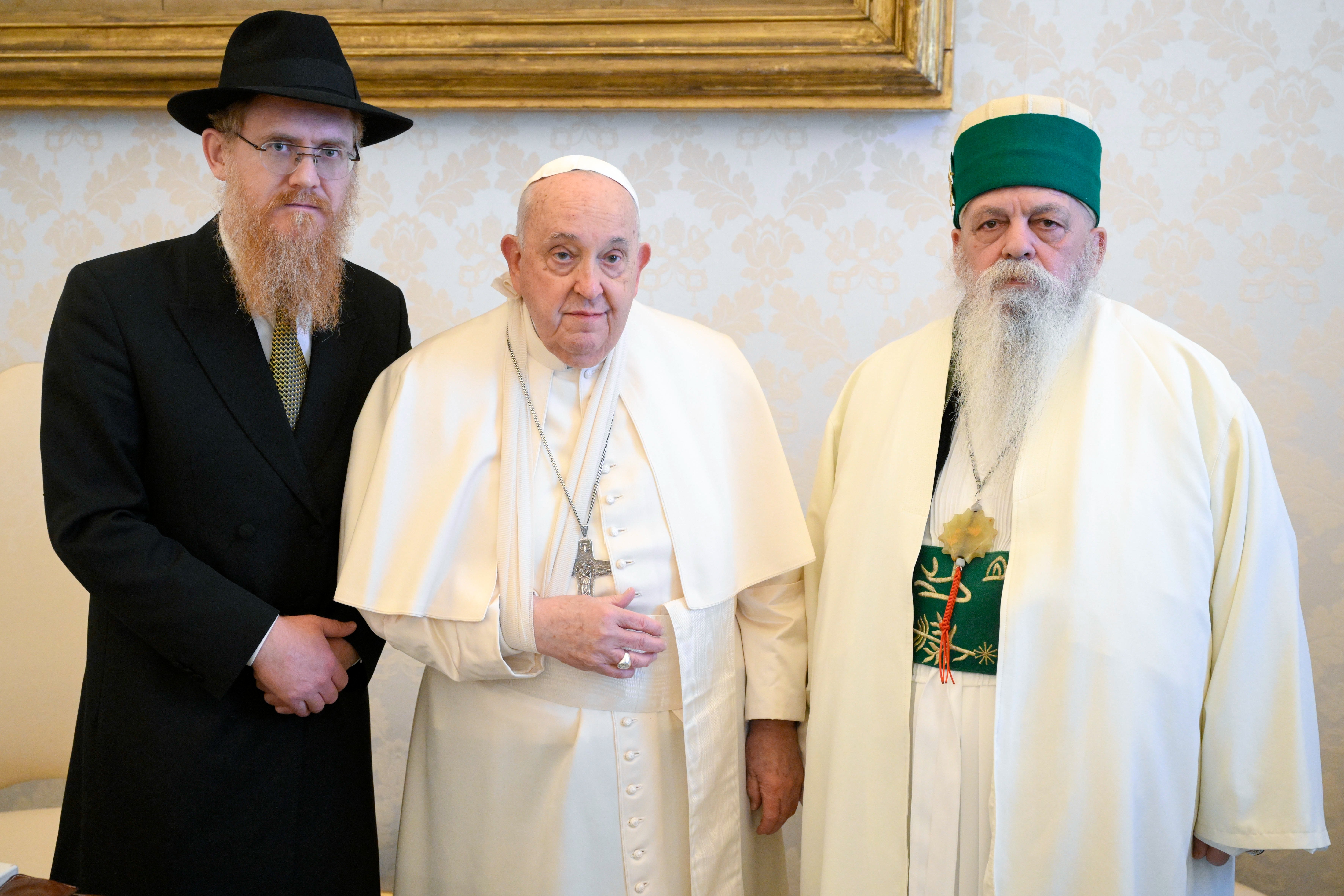 Pope Francis, wearing a sling on his right arm after a fall, poses for a photo with Edmond Brahimaj, right, leader of the Bektashi community of Muslim Sufis from Tirana, Albania, during a meeting at the Vatican Jan. 16, 2025. The Vatican said the pope injured his arm in a fall and while nothing was broken, the arm was immobilized as “a cautionary measure.” (CNS photo/Vatican Media)