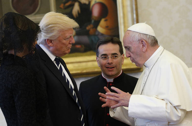 Pope Francis talks with U.S. President Donald Trump during a private audience at the Vatican May 24 (CNS photo/Paul Haring).