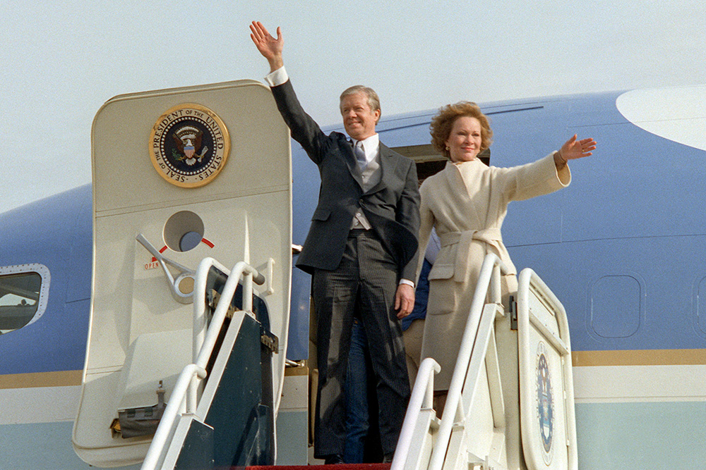 Former President Jimmy Carter and his wife, Rosalynn, wave from the top of the aircraft steps as they depart Andrews Air Force Base at the conclusion of President Ronald Reagan's inauguration ceremony on Jan. 20, 1981. (Wikimedia Commons/U.S. Air Force)