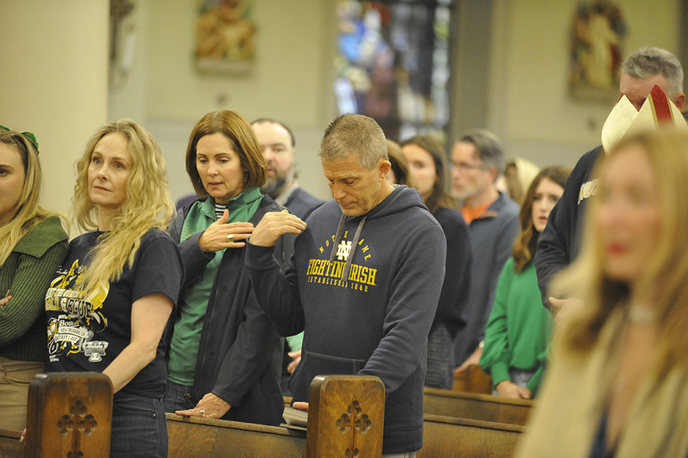 Notre Dame fans attended a Mass Jan. 1, 2025, at St. Louis Cathedral following a truck assault in the French Quarter that killed 15 people and injured three dozen others. Archbishop Gregory Aymond and 600 worshipers struggled to make sense of the death and carnage perpetrated by a man who drove a pickup truck into a dense crowd of early-morning New Year's revelers just five blocks away on Bourbon Street. (OSV News/Clarion Herald/Peter Finney Jr.)