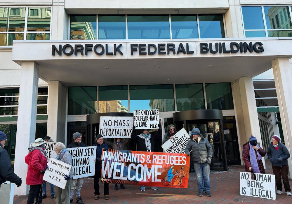 More than 15 people gathered Jan. 20 outside of the Federal Building in downtown Norfolk, Virginia, to protest President Donald Trump's planned mass-deportation of immigrants who are in the country illegally. (Bob McCabe)