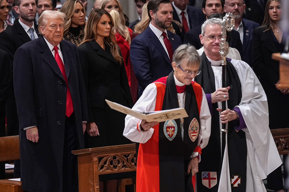 President Donald Trump, left, watches as Bishop Mariann Budde arrives at the national prayer service at the Washington National Cathedral Jan. 21, 2025, in Washington, D.C. (AP/Evan Vucci)