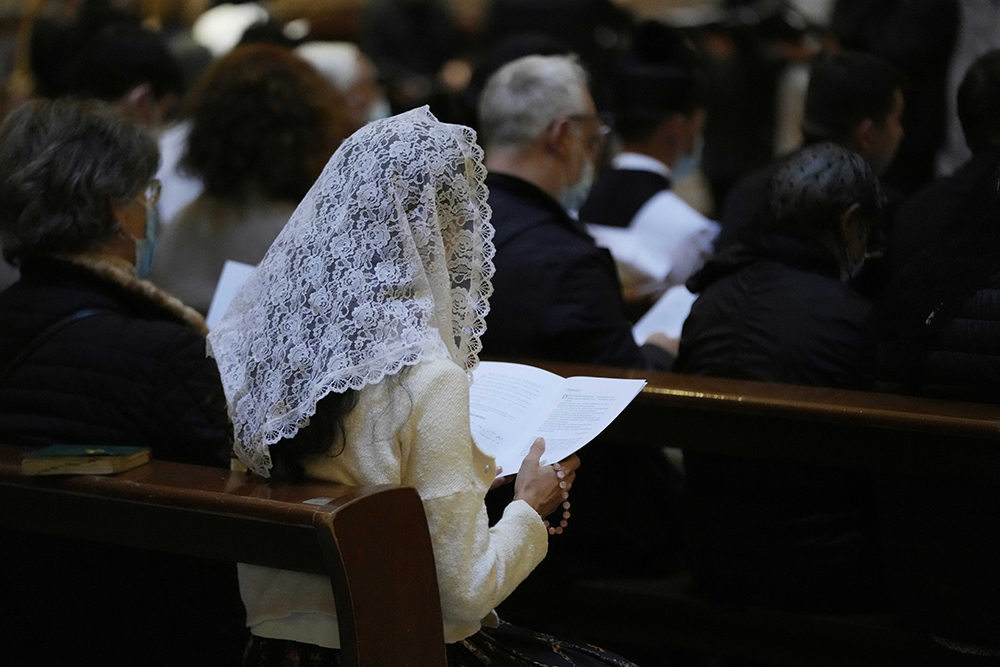 A faithful reads during a Latin Mass at Rome's ancient Pantheon basilica, in Rome, Italy on Oct. 29, 2021. (AP/Luca Bruno)