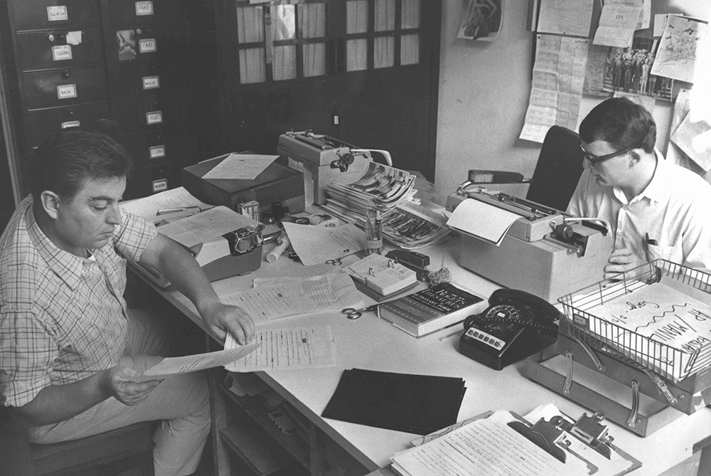 The Associated Press staffers Horst Faas, left, and Carl Robinson, right, work on the photo desk at AP's Saigon Bureau, preparing radio photos, originals and news/photo packages in April 1968. Exact date is unknown. (AP Photo/AP Corporate Archives)