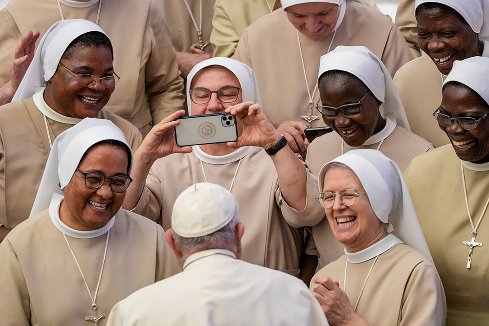 Pope Francis meets a group of nuns during his weekly general audience in the Pope Paul VI Hall at the Vatican, on Aug. 30, 2023. (AP/Andrew Medichini, File)