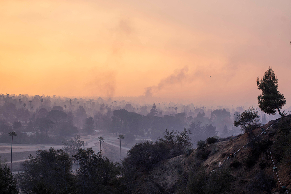 Smoke rises as the wildfires burn in the Los Angeles area Jan. 9. One of the biggest fires, the Eaton Fire in Altadena, Calif., badly damaged the Mater Dolorosa Passionist Retreat Center in Sierra Madre. (OSV News/Reuters/Ringo Chiu)