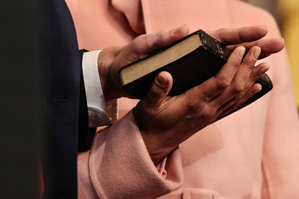 JD Vance takes the oath of office with his hand on a Bible that once belonged to his great-grandmother and is held by his wife, Usha Vance, as he is sworn in as vice president of the United States during inauguration ceremonies in the Rotunda of the U.S. Capitol Jan. 20, 2025, in Washington. (OSV News/Chip Somodevilla, Pool via Reuters)