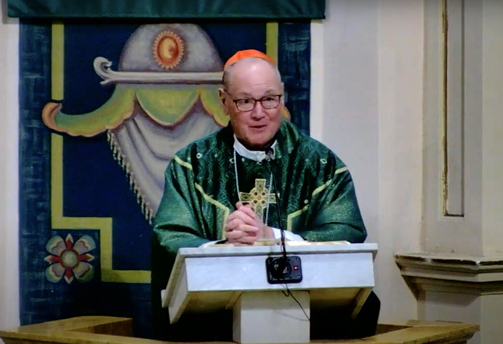 Cardinal Timothy Dolan of New York delivers a homily Feb. 15 at the Basilica Cathedral of St. John the Baptist in St. John's, Newfoundland. The cardinal's flight to Ireland was unexpectedly diverted due to a passenger's medical emergency and then delayed by high winds. (OSV News screenshot/YouTube/Basilica Heritage Foundation)