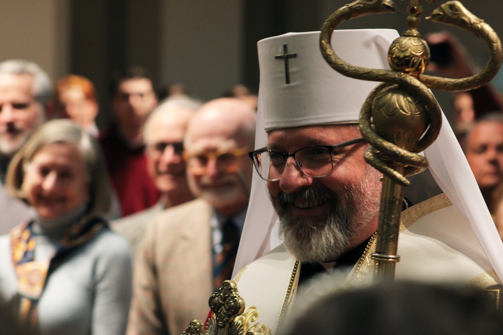 The bishop wears Greek vestments and carries staff.