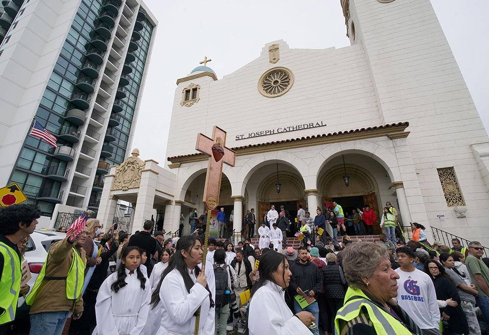 Participants gather outside the Cathedral of St. Joseph in San Diego on Feb. 9, after a prayer service for immigrants. They were getting ready to take part in a multi-faith procession to the Edward J. Schwartz Federal Building in San Diego where they held a prayer vigil. (NCR photo/Chris Stone)