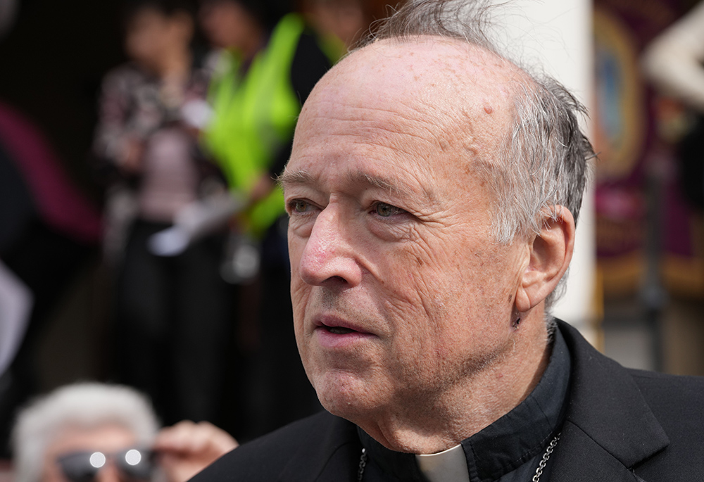 San Diego Cardinal Robert McElroy speaks to reporters prior to a prayer service for immigrants at the Cathedral of St. Joseph, Feb. 9 in San Diego. (NCR photo/Chris Stone)