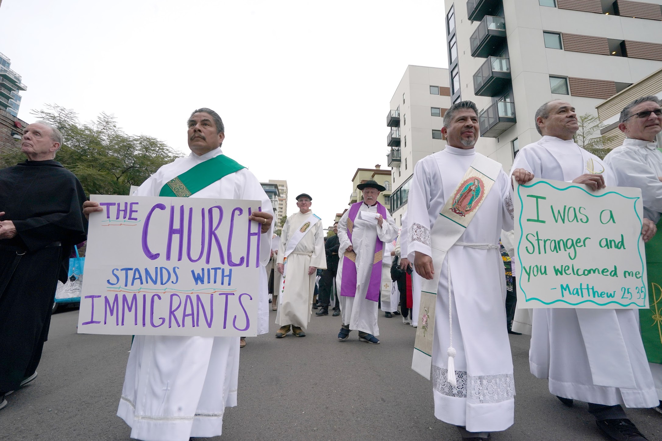 Following a prayer service for migrants in San Diego, California, participants march from the city's Catholic cathedral to the Federal Building. (Chris Stone)