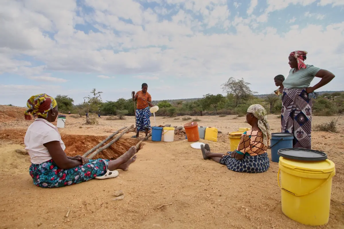 Women use a depleted well in rural Zimbabwe in the summer of 2024, during an El Nino-induced drought. USAID has spent millions of dollars on drought support in the country. Jekesai Njikizana / AFP via Getty Images