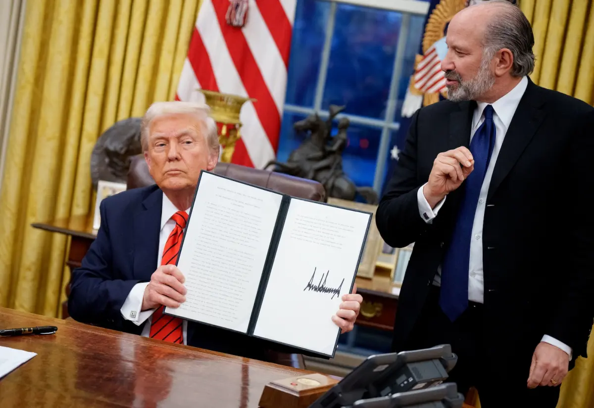 President Trump holds his signed executive order to end federal procurement of paper straws. Andrew Harnik / Getty Images