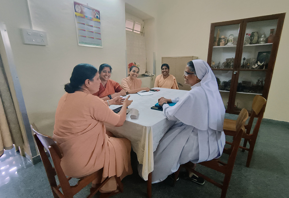 Apostolic Carmel Sr. Maria Nirmalini, head of the Conference of Religious Women India, discusses the revision of formation for religious women in India with program director Sr. Molly Mathew, right, and others at their office in Bengaluru, southern India. (Courtesy of Molly Mathew)