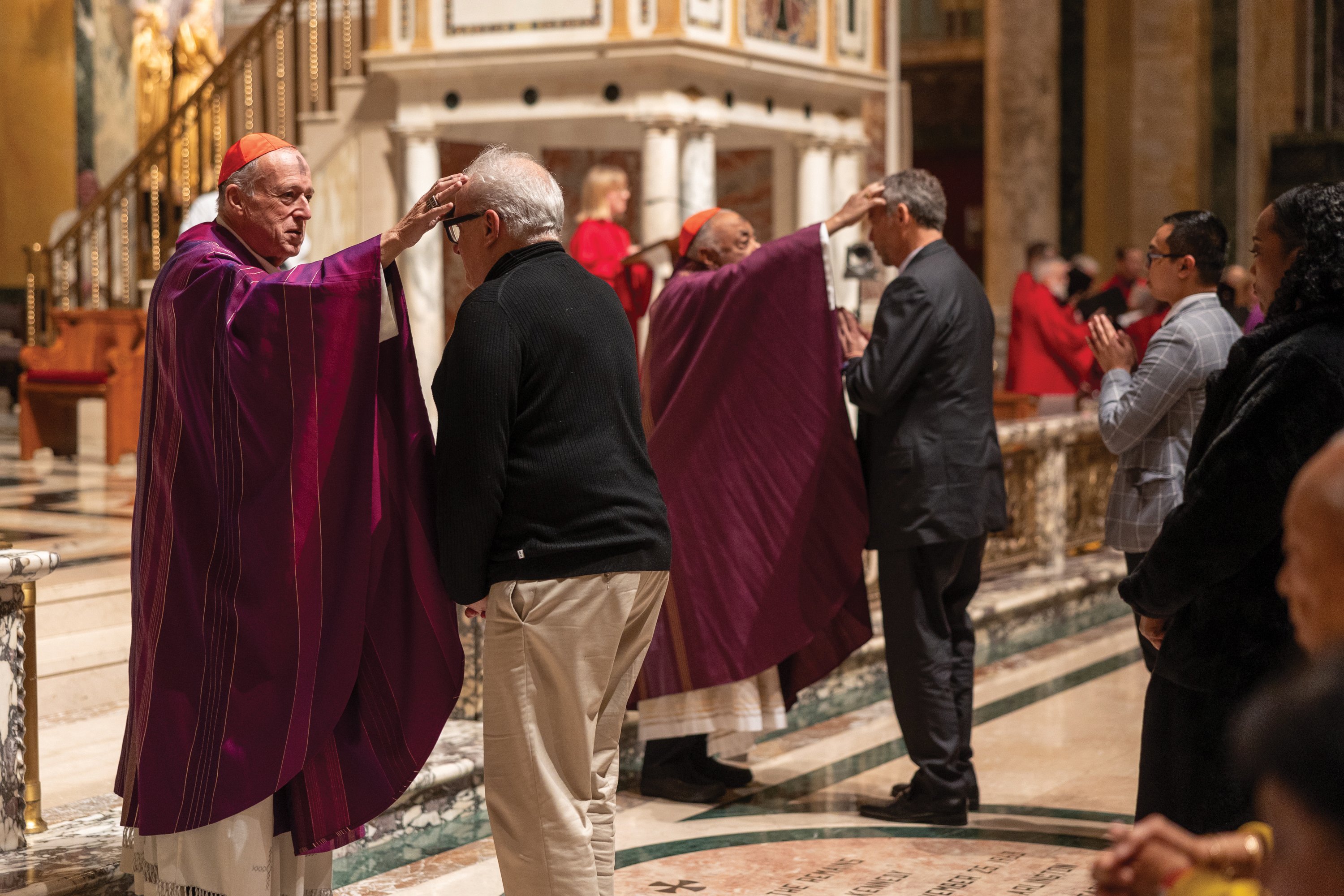 Cardinal Robert W. McElroy, left, and Cardinal Wilton D. Gregory, the retiring archbishop of Washington, dispense ashes during Ash Wednesday Mass March 5, 2025, at the Cathedral of St. Matthew the Apostle in Washington. Cardinal McElroy will be installed March 11 as the eighth archbishop of Washington. (OSV News photo/Mihoko Owada, Catholic Standard)