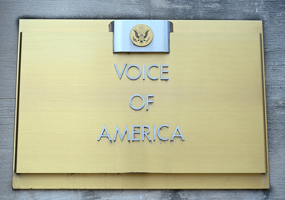 Signage is seen outside the Voice of America building March 16 in Washington, a day after more than 1,300 employees of the media broadcaster, which operates in almost 50 languages, were placed on leave. (OSV News/Reuters/Annabelle Gordon)