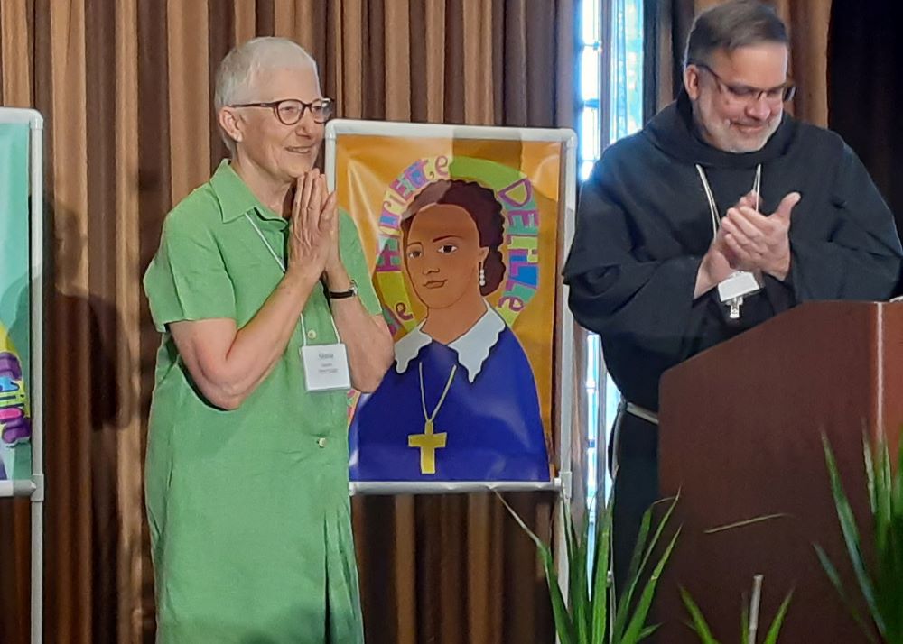 Marie Dennis and Bishop Stowe at award ceremony.