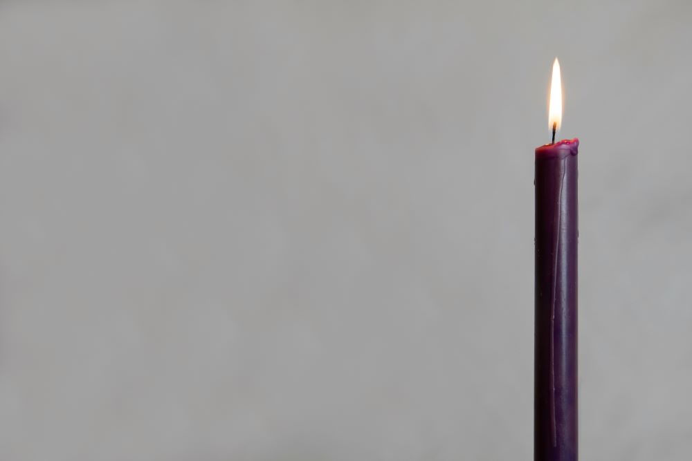 Lit purple candle