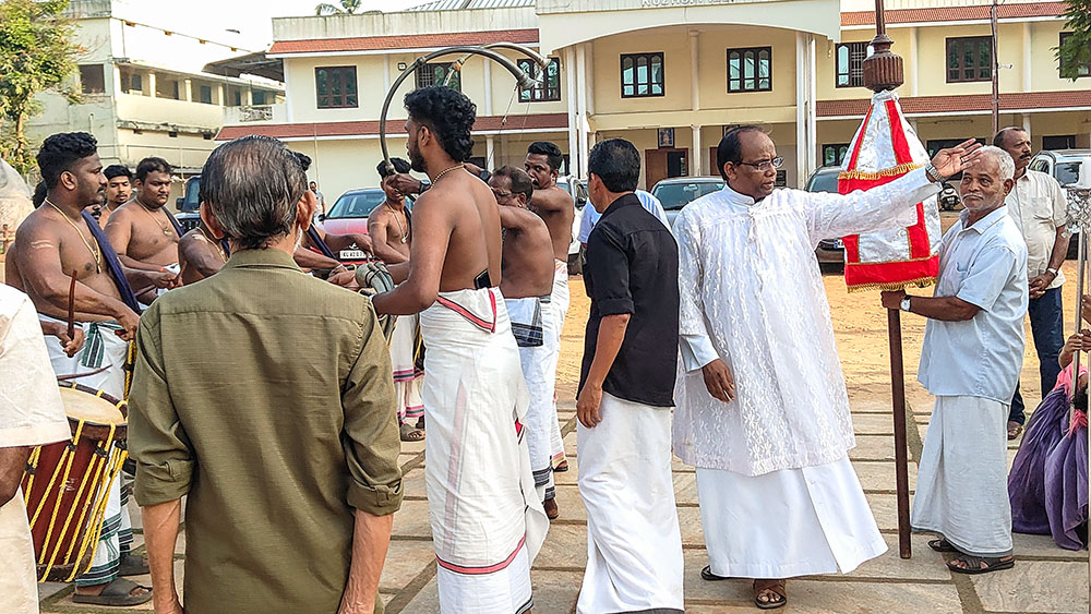 Fr. Kuriakose Mundadan, parish priest of St. Augustin's Church, Kuzhuppilly, leads a procession for a feast. The parish is under the Ernakulam-Angamaly Syro-Malabar Archdiocese in the southwestern Indian state of Kerala. (Thomas Scaria)