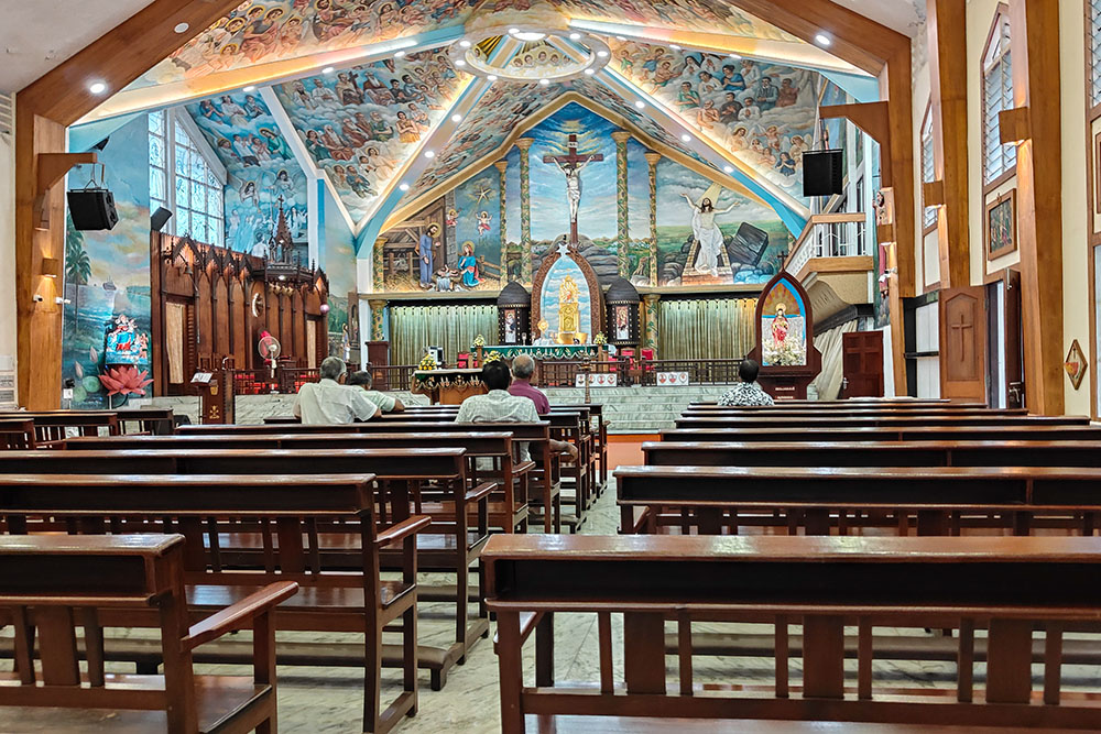 People pray at the St. Mary's Basilica Cathedral, the main church of the Ernakulam-Angamaly Archdiocese in the southwestern Indian state of Kerala. (Thomas Scaria)