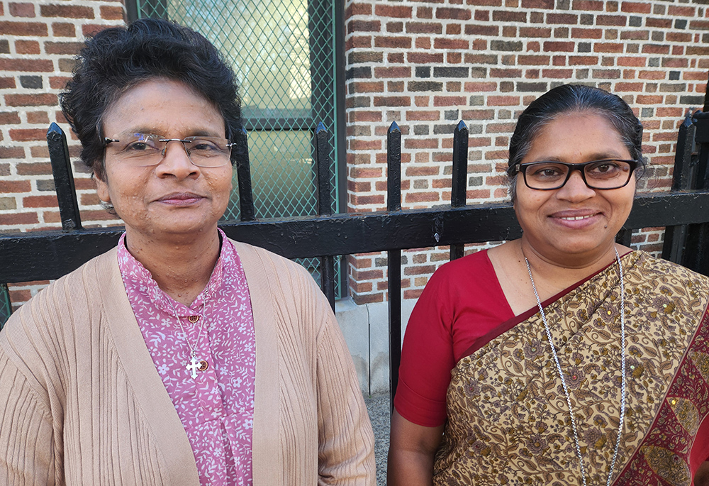 Indian Medical Mission Srs. Regy Augustine, left, and Babita Kumari, are pictured in front of a Catholic school in Queens, New York City, near where the sisters are staying in a convent while attending the United Nations' 69th session of the Commission on the Status of Women. (GSR photo/Chris Herlinger)