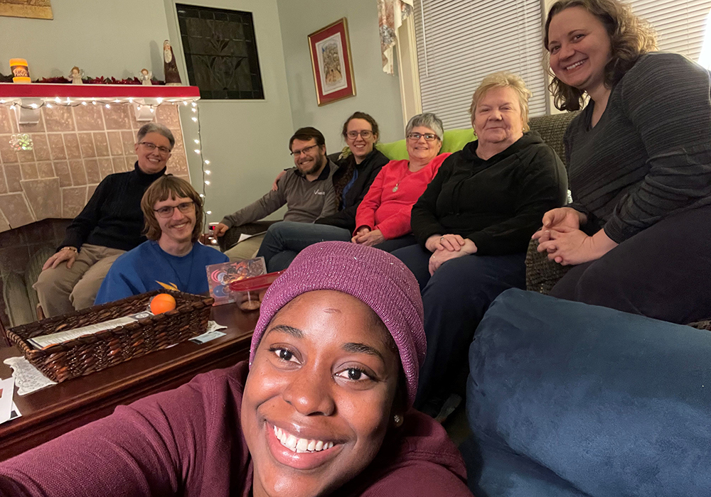 A group gathered for a prayer service at the House of Discernment is pictured in a photo. The house is located in the Millvale suburb of Pittsburgh. (Courtesy of Caryn Crook)