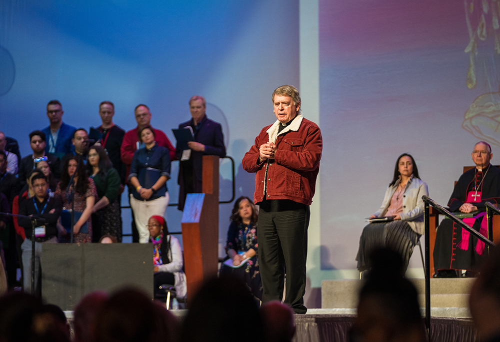 Msgr. Liam Kidney, pastor of Corpus Christi Church in Pacific Palisades, California, shares his testimony at the 2025 Religious Education Congress' opening ceremony Feb. 21. Amid the embers of the Palisades Fire that destroyed the church, firefighters rescued the tabernacle. (OSV News/Courtesy of Archdiocese of Los Angeles/Isabel Cacho)