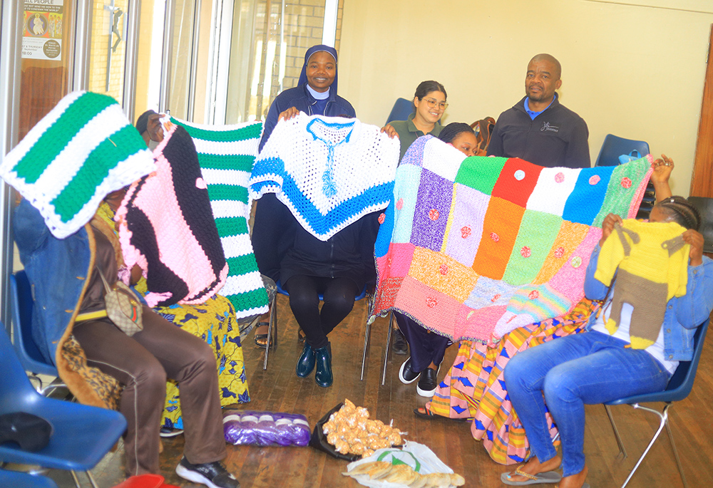 Women who are refugees, migrants, and asylum-seekers showcase their handmade products for sale at the Office for Pastoral Care of Migrants and Refugees in Pretoria, South Africa. The office, run by the sisters, provides skills training in areas such as sewing and catering to help these women become self-reliant. (GSR photo/Doreen Ajiambo)