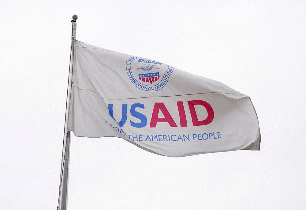 A flag flies outside the U.S. Agency for International Development building Feb. 3 in Washington, as the agency sits closed to employees after a memo was issued advising USAID personnel to work remotely. (OSV News/Reuters/Kent Nishimura)