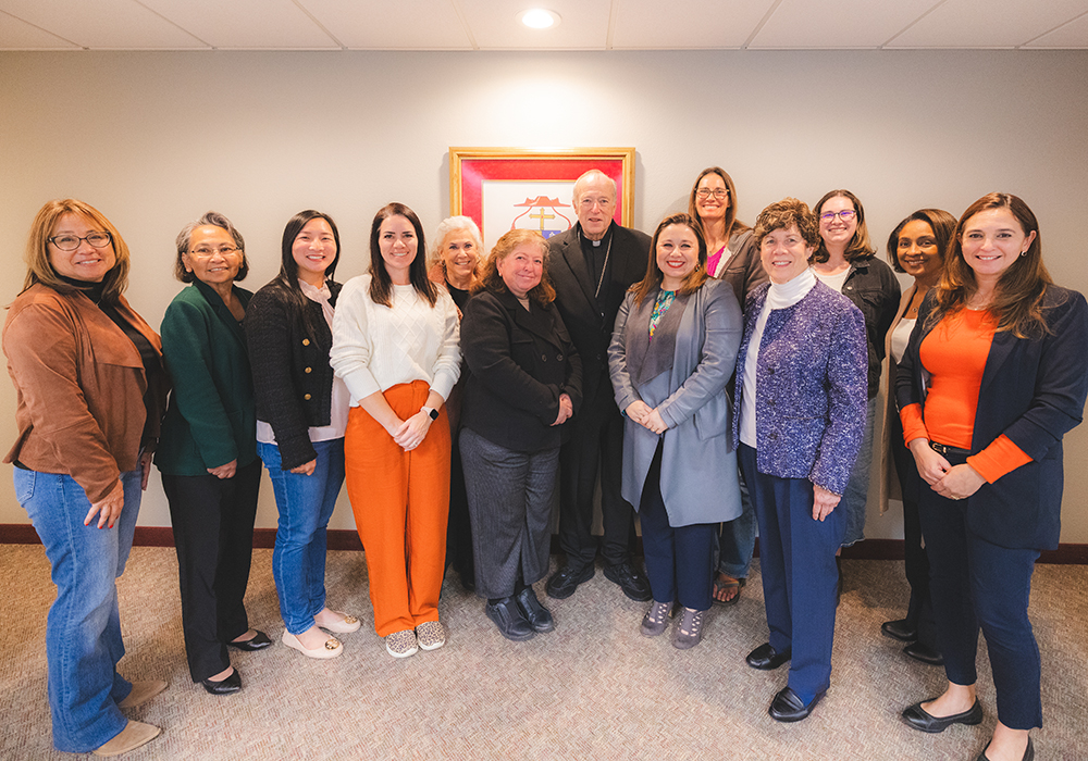 Members of the Women's Advisory Committee pose with Cardinal Robert McElroy, formerly of the San Diego Diocese. The committee conducted a survey of parishes, pastors and women in leadership within the diocese. (Leonardo Enrique Fonseca)