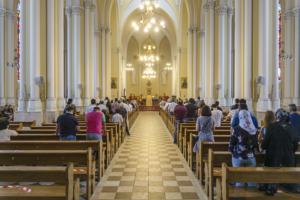 People pray at the Catholic Cathedral of the Immaculate Conception of the Holy Virgin Mary in Moscow in an undated photo. (Dreamstime/Uladzimir Zuyeu)