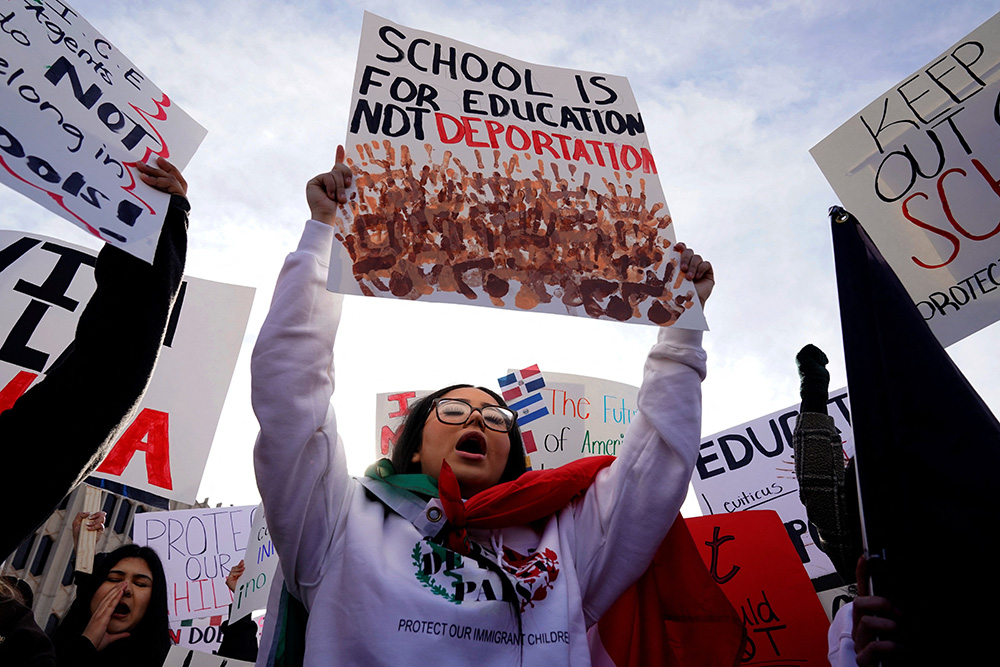 Protesters opposing possible Immigration and Customs Enforcement (ICE) raids in public schools chant outside the State Department of Education in Oklahoma City Jan. 28, 2025, during their monthly board meeting. (OSV News/Reuters/Nick Oxford)