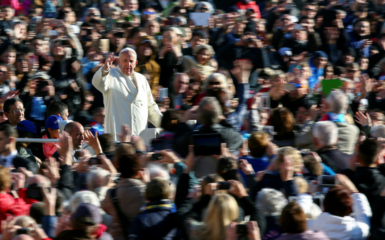 Pope Francis waves as he arrives to lead his general audience in St. Peter's Square Nov. 16. (CNS/Reuters/Alessandro Bianchi) 