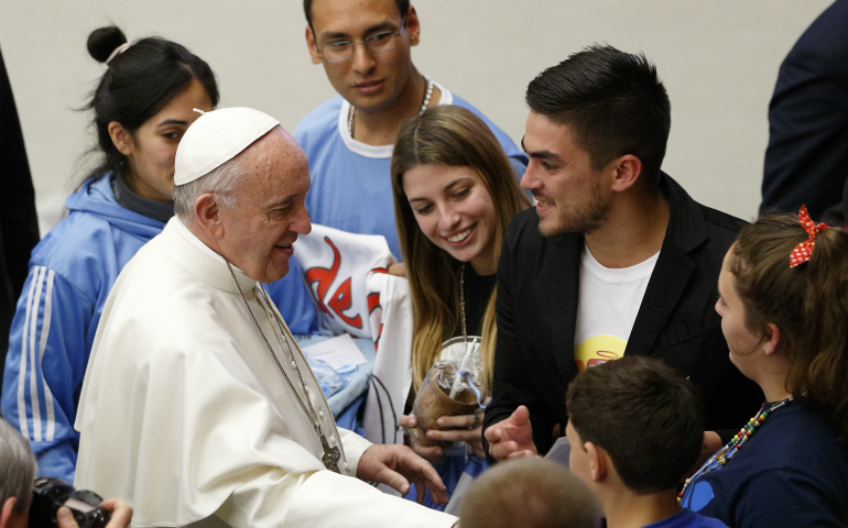 Pope Francis greets young people during his general audience in Paul VI hall at the Vatican Dec. 7. At his audience the pope began a new series of talks about hope. (CNS photo/Paul Haring)