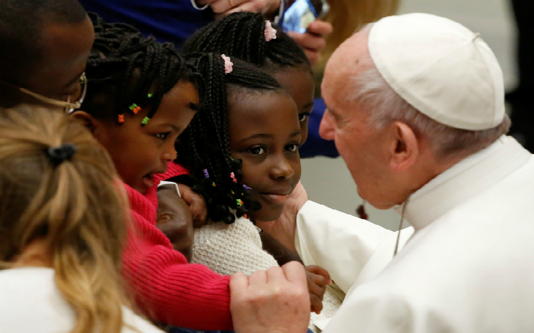 Pope Francis greets young people during his weekly audience Jan. 4 in Paul VI hall at the Vatican. (CNS photo/Tony Gentile, Reuters)