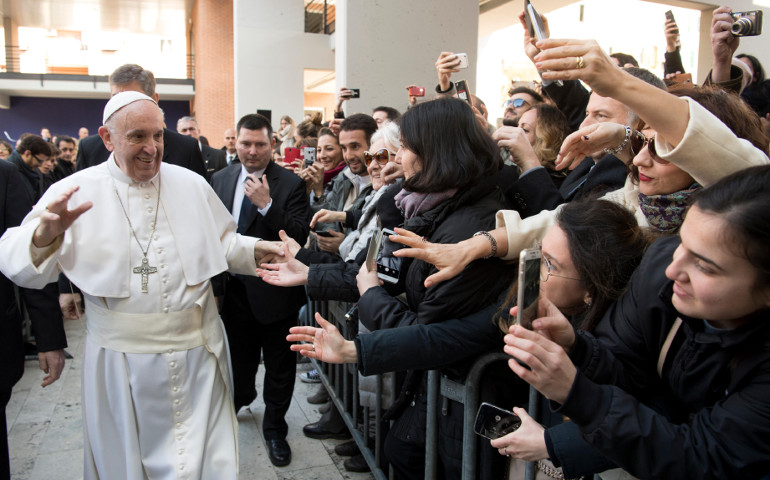 Pope Francis greets people as he arrives for a Feb. 17 meeting at Roma Tre University. (CNS / L'Osservatore Romano, handout) 