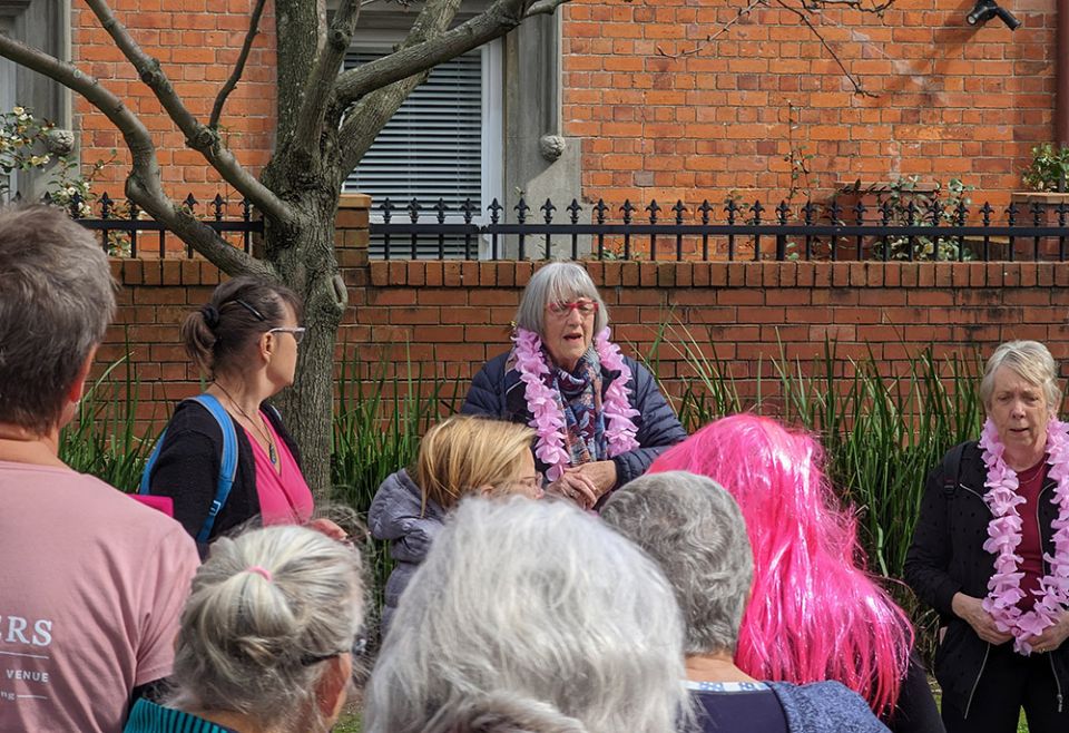 Jo Ayers, founding member of "be the change" in Auckland, speaking at the event in that city on September 18 (Courtesy of Luc Powell)