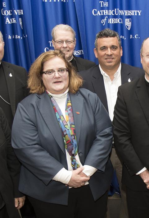 Teresa Pitt Green, left, and Luis Torres Jr., right, pose for a photo with U.S. prelates on May 1, 2019, at the Catholic University of America in Washington, D.C. (CNS/Bob Roller)