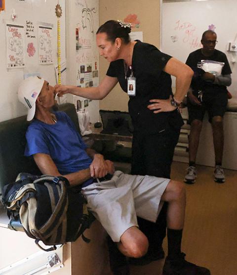 A man from a homeless encampment receives care from Circle The City's mobile medical unit on the 14th day of temperatures rising to 114 degrees Fahrenheit in Phoenix July 13, 2023. (OSV News/Reuters/Liliana Salgado)