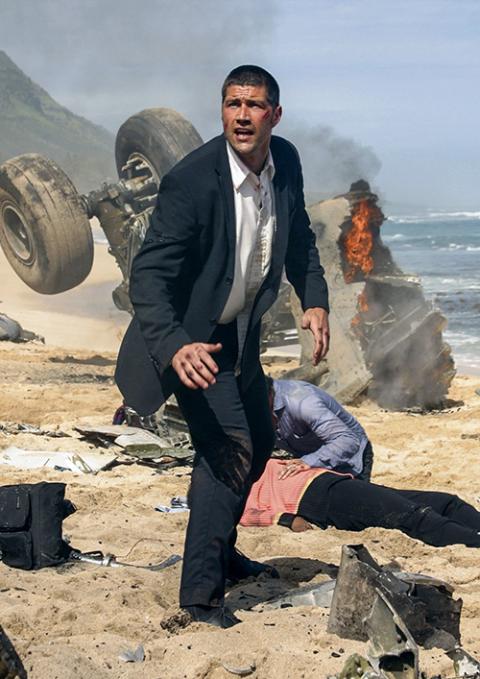 Jack, played by actor Matthew Fox, is seen amid plane wreckage in the first episode of the 2004-2010 series "Lost." (CNS/ABC)