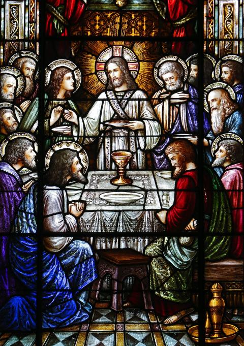 Jesus and his apostles at the Last Supper are depicted in a stained-glass window at St. Aloysius Church in Great Neck, N.Y. (CNS/Gregory A. Shemitz)