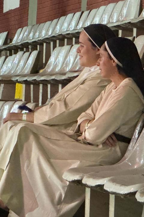 Srs. Paula Radichi, left, and Ariela Jara watch a dance Nov. 23, 2024, during the V Latin American and Caribbean Congress on Religious Life by CLAR in Córdoba, Argentina. The Mercedarian Sisters of the Child Jesus said the meeting had given them hope as they were able to meet and talk with women and men religious from various countries and of different ages. (GSR photo/Rhina Guidos)