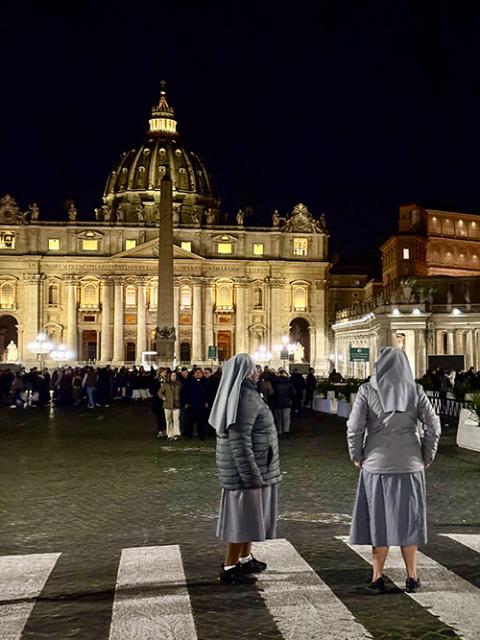 Catholics in St. Peter’s Square on the night of Friday, Feb. 28, after the daily rosary (NCR photo/Camillo Barone)