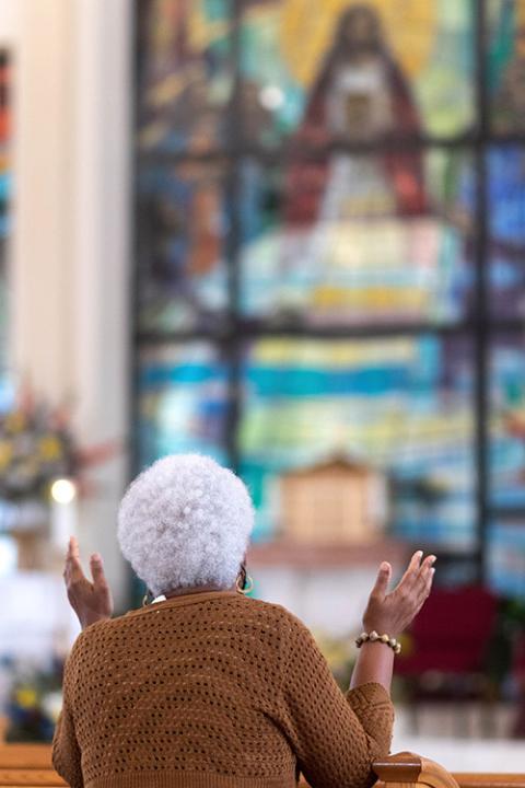 A worshipper at Notre Dame d'Haiti Mission in Miami (Florida Catholic/Tom Tracy)